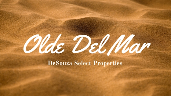Image of beach sand with graphic that reads "Olde Del Mar: DeSouza Select Properties"